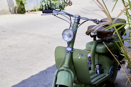 Vintage Italian green scooter of the Lambretta 125 in classic cars and motorcycle rally - auto moto raduno in Kanchanaburi, Thailand: Mar ,01, 2019のeditorial素材