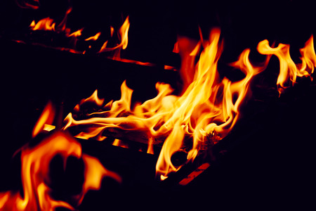 Fire Flame Texture With Motion Blur Effect Over Blackの写真素材