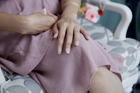 Close up photo of woman doing manicure with nail file, Body-care of hands.
