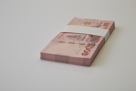 New and latest edition of Thailand one hundred baht banknotes put on on white background. Business...