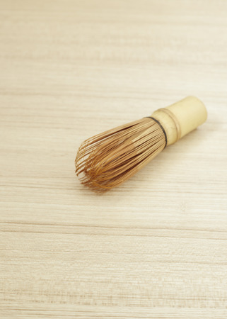 Bamboo tea whisk for matcha on wooden table background, traditional culture of Japanese matcha teaの写真素材