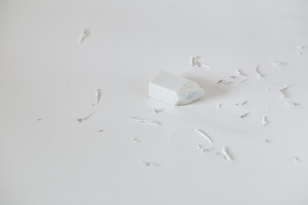 White eraser and eraser leftovers on white background, Education concept