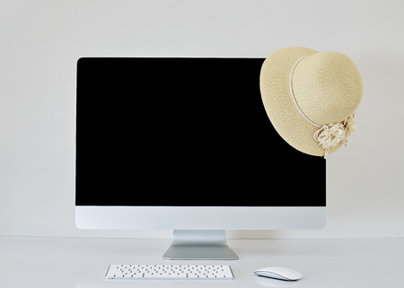 Desktop computer screen summer hatの写真素材