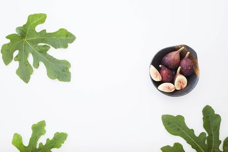 Fresh sliced fresh figs on white background . Figs collection