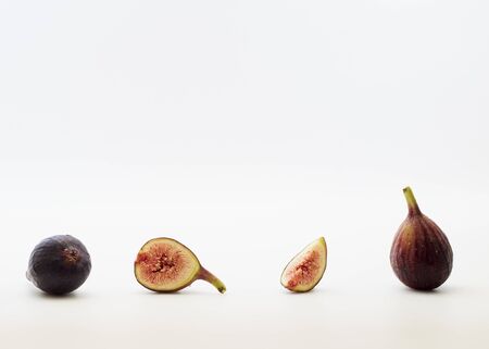 Fresh sliced fresh figs on white background . Figs collectionの写真素材