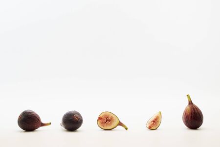 Fresh sliced fresh figs on white background . Figs collectionの写真素材