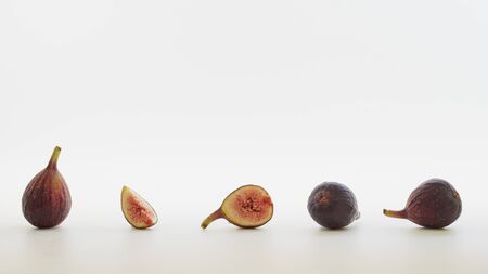 Fresh sliced fresh figs on white background . Figs collectionの写真素材