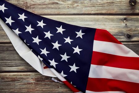 American flag on old rustic wooden board. Concept Important Day American Empty space for design