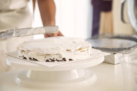 Young asian woman making candy crape cake in the kitchen