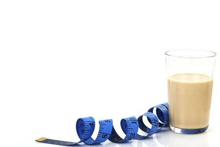 Alarm clock, Measuring Tape and Soy Milk Healthy food background minimal copy space for textの写真素材