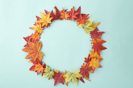 autumn leaves decorative Halloween on pastel pale blue background, with copy space for text. Flat...