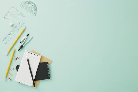 Creative arrangements of stationery on pastel pale blue background. Top view or flat lay. Education...