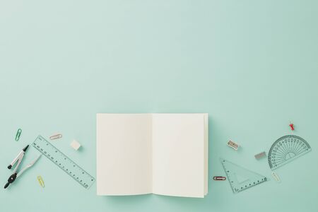 Creative arrangements of stationery on pastel pale blue background. Top view or flat lay. Education...