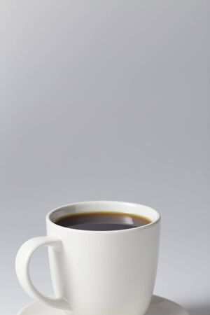 Cup of coffee black on bright gray background, Coffee shop business conceptの写真素材