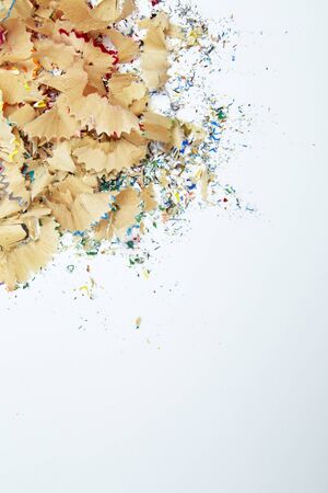 Shavings from multicolored pencils on white background, Education, Back to school Concept.の写真素材