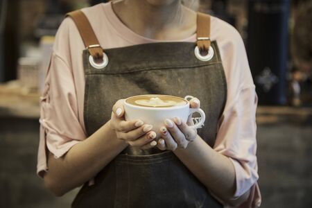 Asian Women Barista Working Holding Coffee Cup  At Cafe Working woman small business owner or sme conceptの写真素材