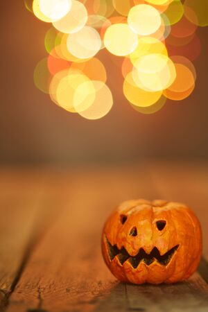 Halloween pumpkin on a bokeh lights background,  copy space for textの写真素材