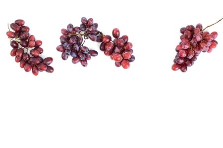 Bunch of fresh ripe juicy red grape flat lay on white background, copy space for textの写真素材