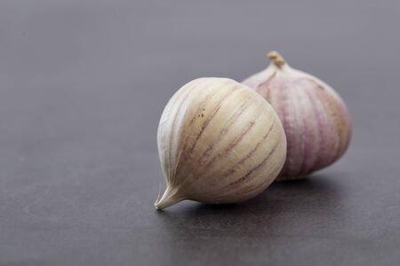 Closeup from chinese bulb garlics on on the cooking table, copy space for textの写真素材