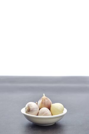 Closeup from chinese bulb garlics on on the cooking table, copy space for textの写真素材