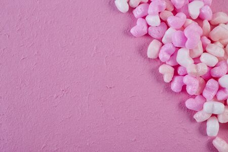 Happy Women's, Mother's, Valentine's Day, birthday greeting card design Pink foam hearts pink paper background, copy space for textの写真素材