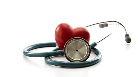 Close up of red heart and stethoscope on white background.  Medical Concept, world health day, copy space for textの写真素材