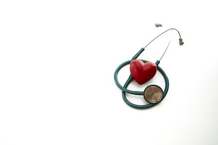 Close up of red heart and stethoscope on white background.  Medical Concept, world health day, copy space for textの写真素材