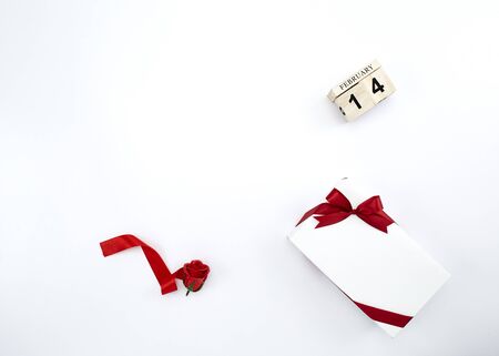 Flat lay Valentines Day background , day love, February 14 concept wooden perpetual calendar on white background, Copy space, composition for textの写真素材