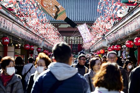 TOKYO, JAPAN - Jan 09 2020 Many people visit Nakamise-dori shopping street at Senso-ji Temple in Tokyo, Japan. Senso-ji is an ancient Buddhist temple located in Asakusa, Tokyo, Japan.のeditorial素材