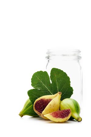 Ripe figs and Empty glass bottle on white background, Vegetarian food conceptの写真素材