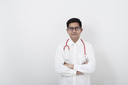 Portrait of young asian doctor isolated on whiteの写真素材