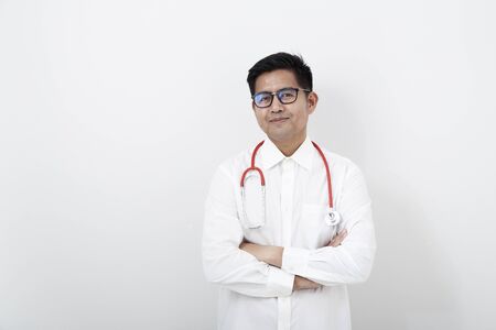 Portrait of young asian doctor isolated on whiteの写真素材