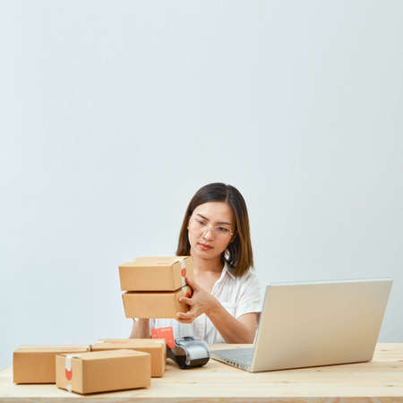 asian girl freelancer business private working at home office with holding tablet, laptop, note,...