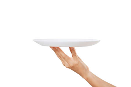 Empty white plate on a woman hand on a white backgroundの写真素材