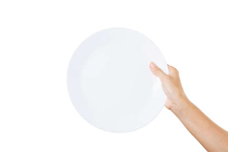 Empty white plate on a woman hand on a white backgroundの写真素材