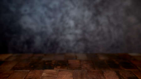 Empty wood table top counter on dark wall background.For create product display or design key visualの写真素材