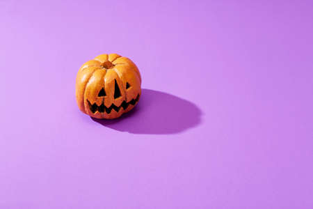 Orange Pumpkin on pastel violet background and copy space, Halloween backdrop, October festival concept holiday, Holiday party, Halloween minimal concept.の写真素材
