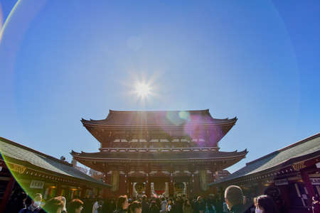 Tokyo, Japan - Jan 09 2020: Asakusa district area with entrance steps to Sensoji temple shrine with red architecture and crowd of peopleのeditorial素材
