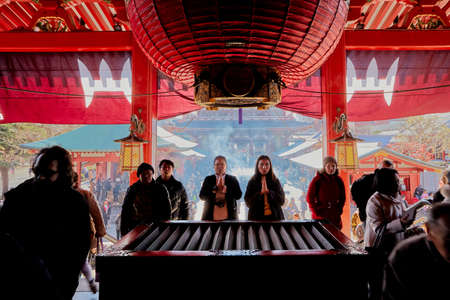 Tokyo, Japan - Jan 09 2020: Asakusa district area with entrance steps to Sensoji temple shrine with red architecture and crowd of peopleのeditorial素材