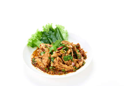 Thai food Spicy grilled pork neck salad served with fresh vegetable on whiteの写真素材