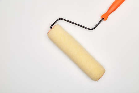 closeup painting roller tools work paint on white backgroundの写真素材