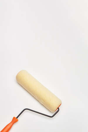 closeup painting roller tools work paint on white backgroundの写真素材