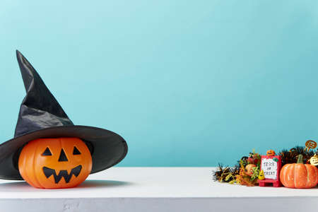 Happy Halloween holiday pumpkin jack o lantern party decorations  on a blue background Copy space for textの写真素材