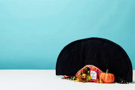 Happy Halloween holiday pumpkin jack o lantern party decorations  on a blue background Copy space for textの写真素材