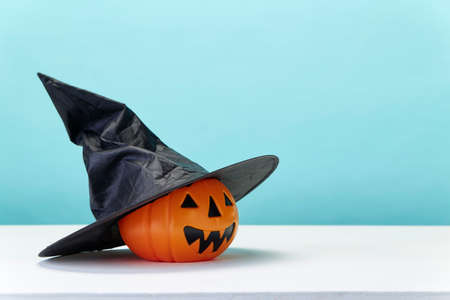Happy Halloween holiday pumpkin jack o lantern party decorations  on a blue background Copy space for textの写真素材