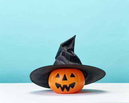 Happy Halloween holiday pumpkin jack o lantern party decorations  on a blue background Copy space for textの写真素材