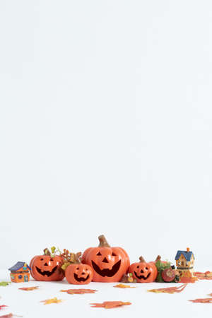 Jack O Lantern  or Pumpkins decor on a white desk at home for happy halloween conceptの写真素材