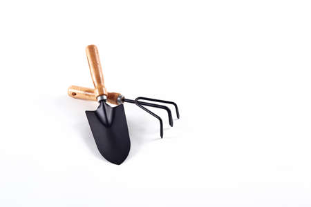Tools garden shovel and rake isolated on white background