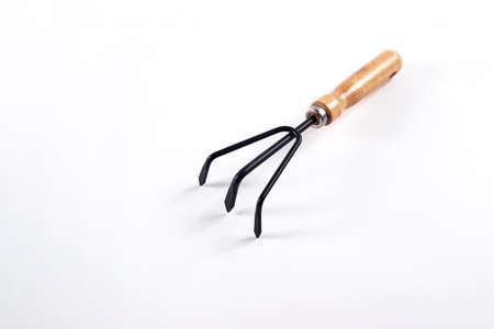 Tool Garden rake isolated on white background