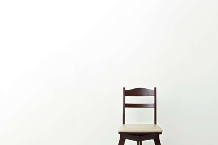 vintage leather wooden armchair on white backgroundの写真素材